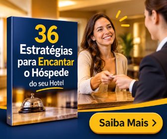 Livro digital com 36 estratégias para encantar o hóspede do seu hotel e sineta metálica sobre o balcão da recepção.